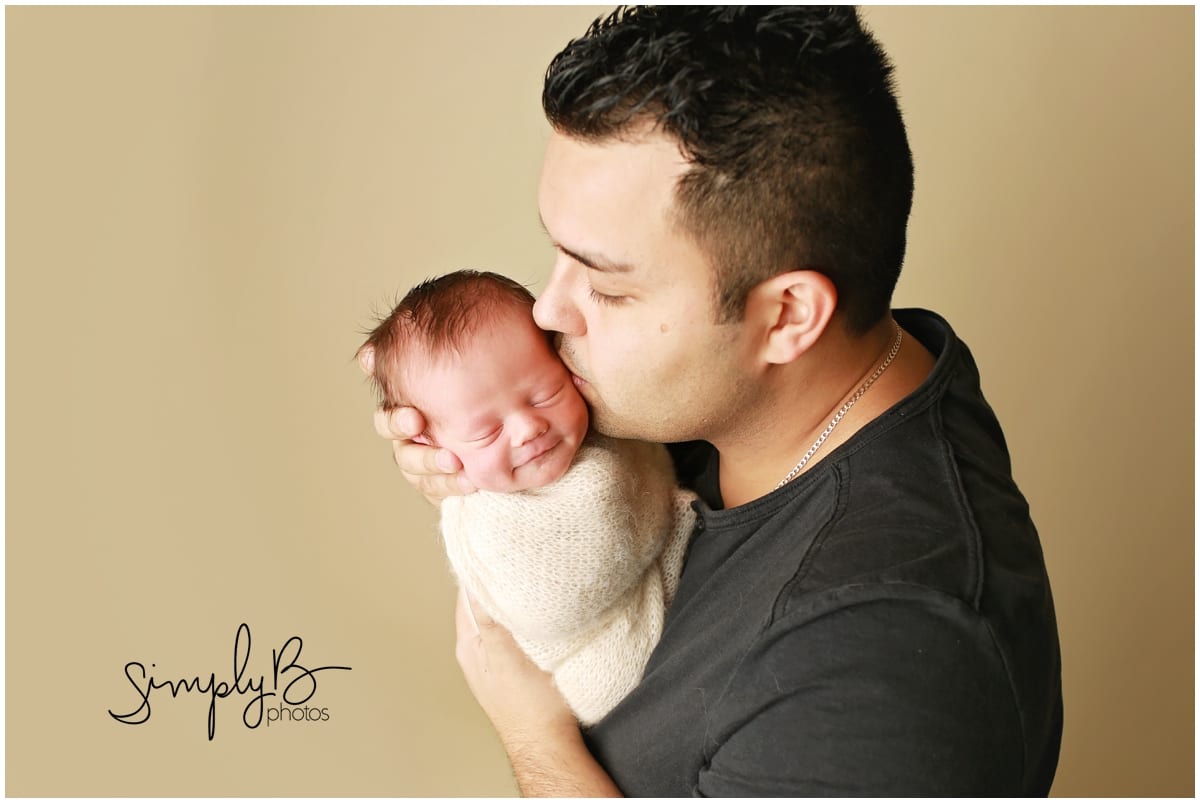 edmonton newborn photographer with dad smiling