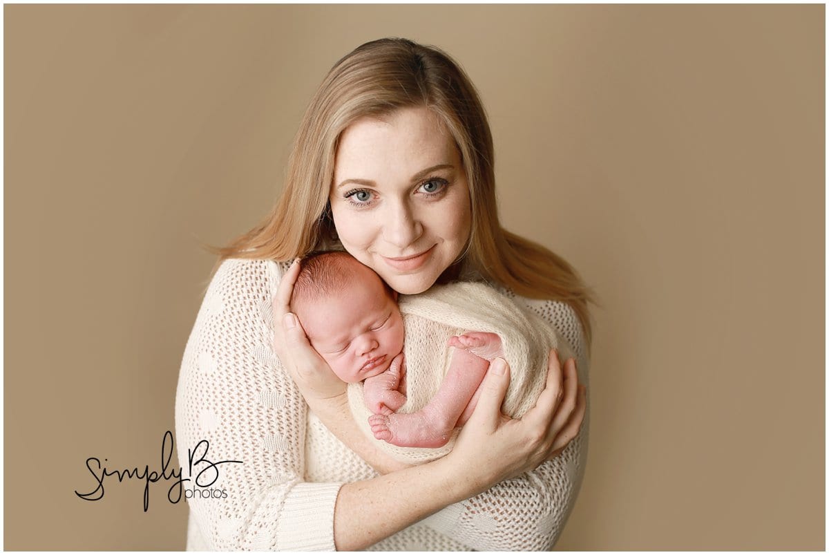 edmonton newborn photographer baby boy with mom poses
