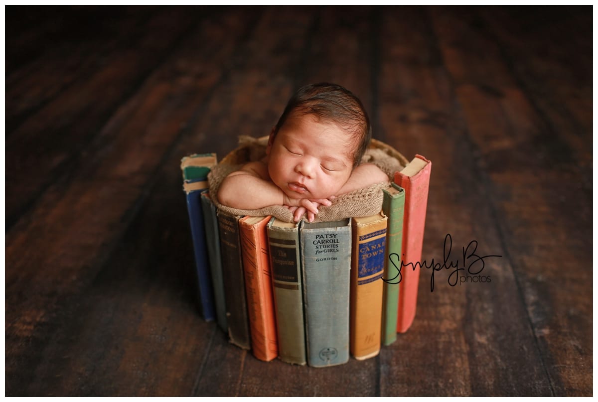 edmonton newborn photographer baby boy bed books