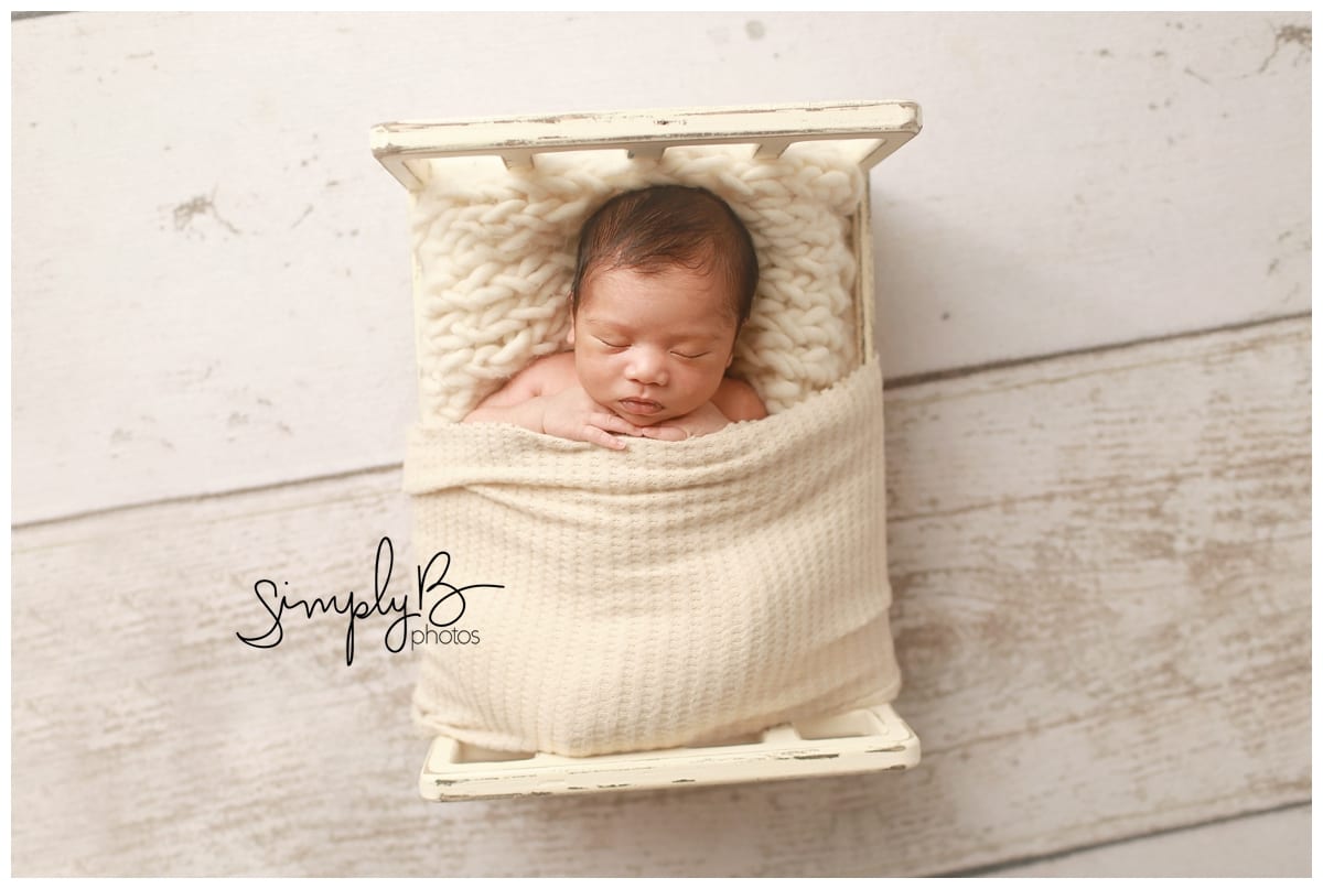 edmonton newborn photographer baby boy bed books