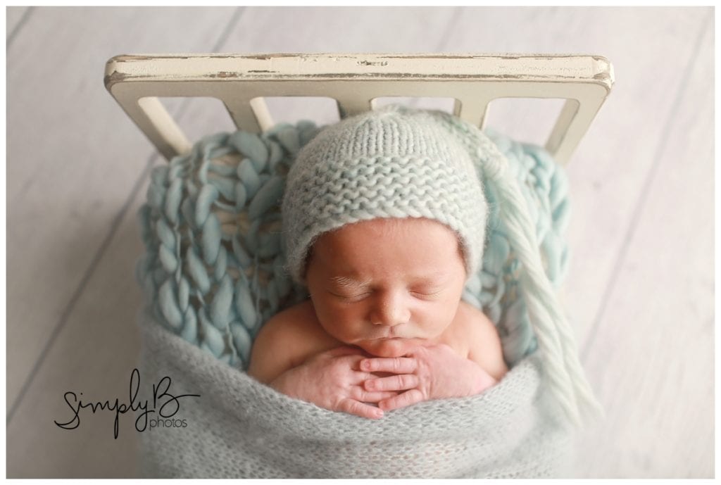 edmonton newborn photographer baby boy blue little bed