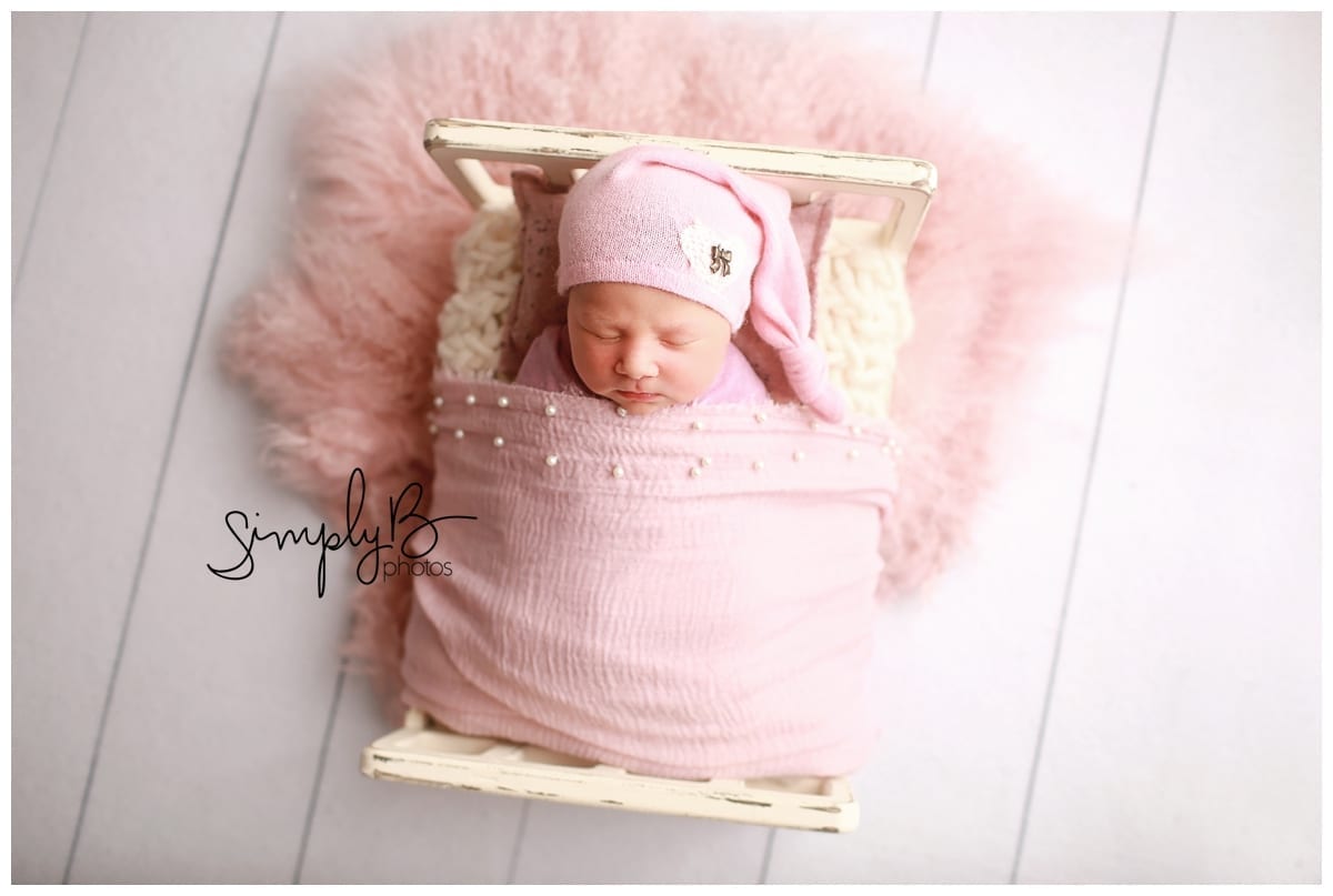 edmonton newborn photographer baby girl little bed