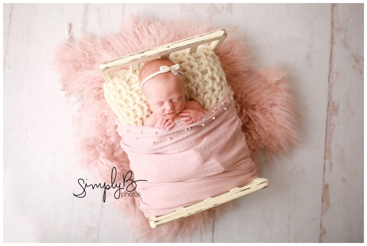 edmonton newborn photographer baby girl baby bed
